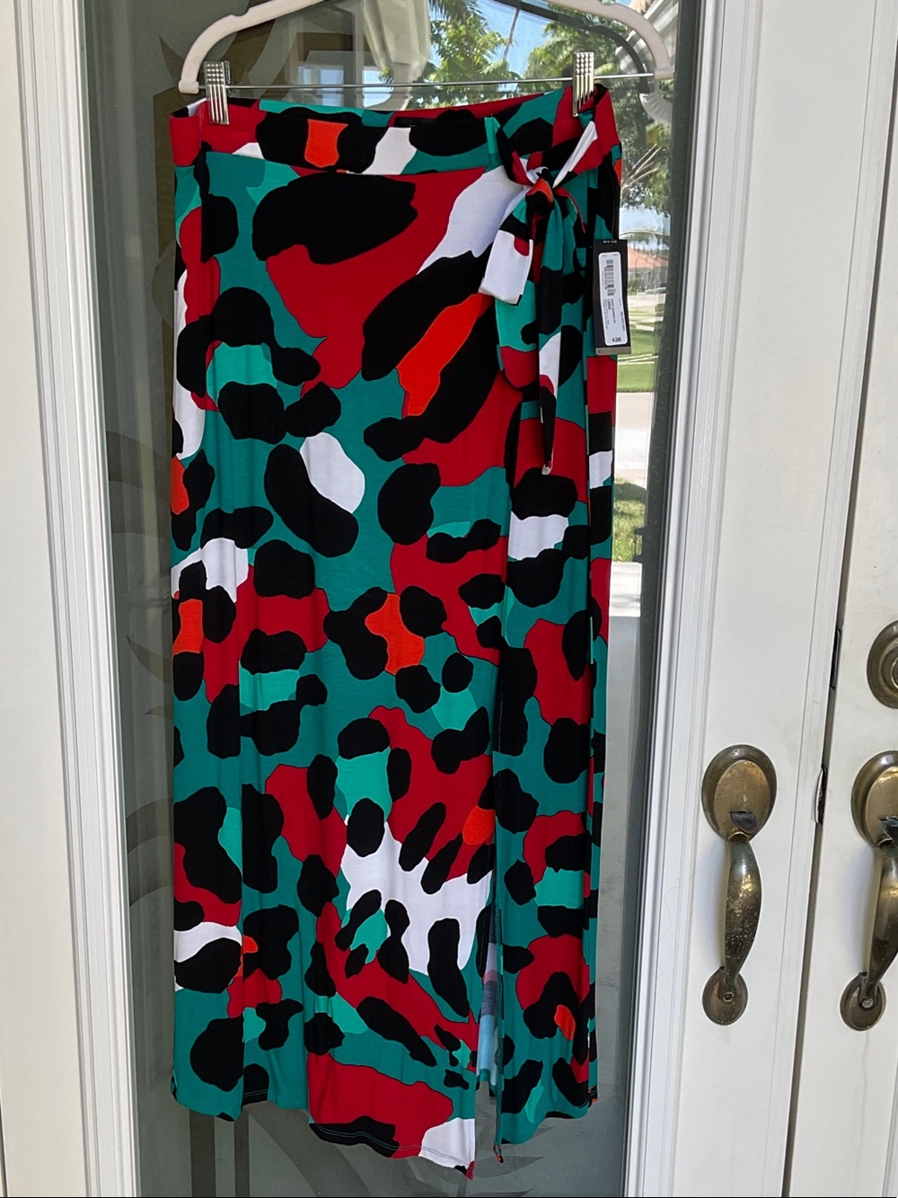 Worthington Bold Abstract Wrap skirt in Teal, Red, Black & White. Side slit
